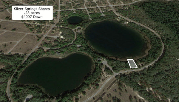 Waterfront .28 acre lot on Paved Road in Silver Springs Shores