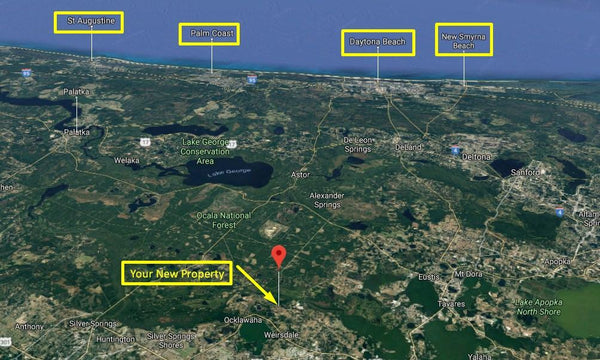 Waterfront .28 acre lot on Paved Road in Silver Springs Shores