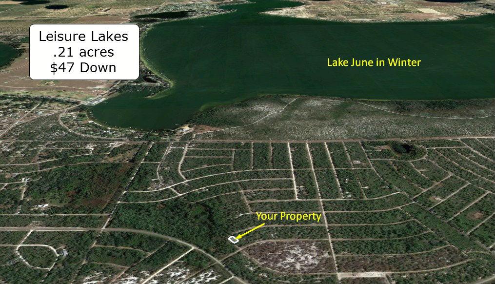 .21 Acre Corner Lot in Lake Placid R1 Zoned Close to Lake June in Winter