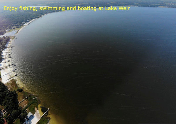 Waterfront .28 acre lot on Paved Road in Silver Springs Shores